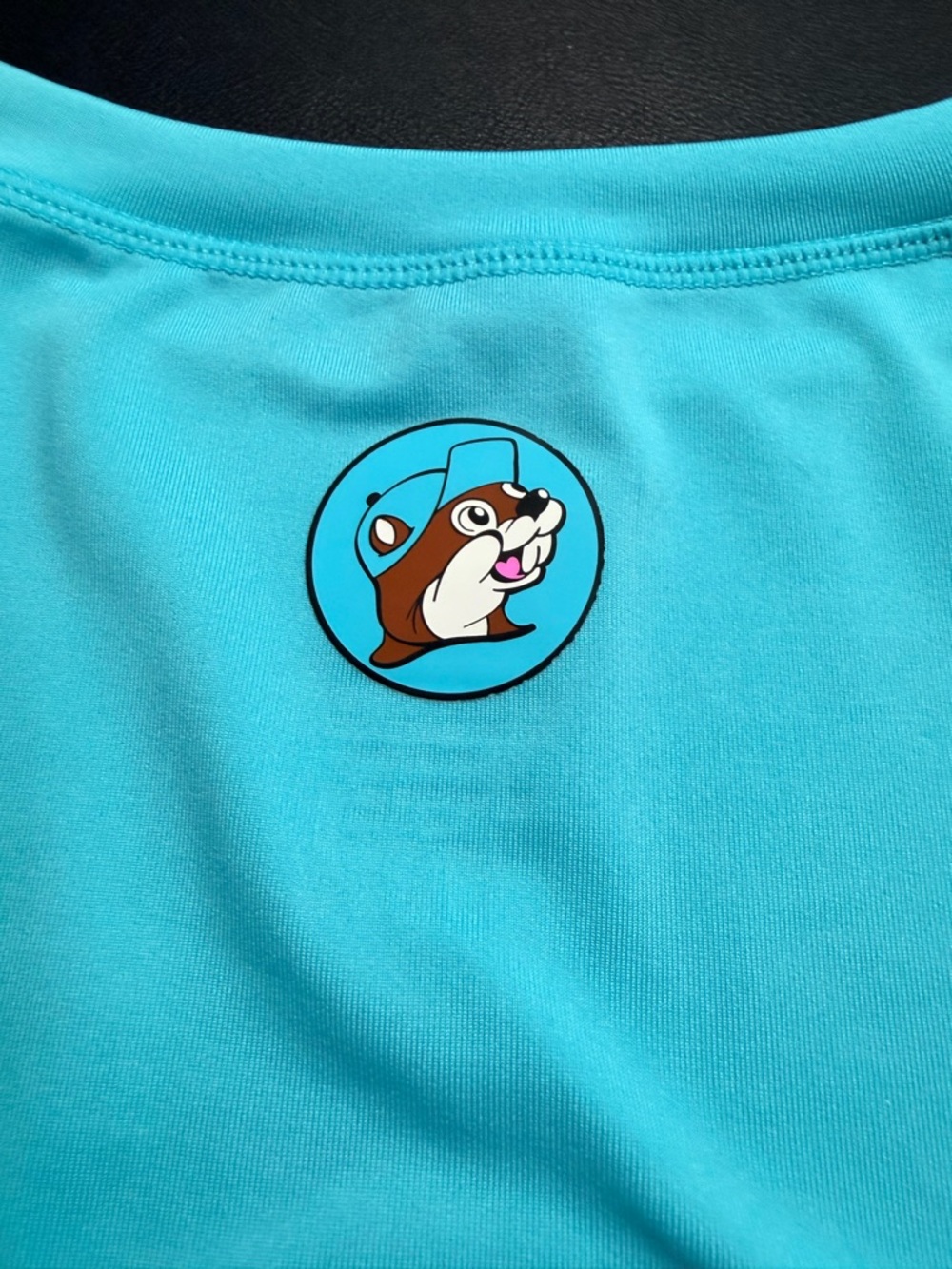 Buc-ees Men's Long Sleeve Swim Tee with Badge on reverse - Aqua Color